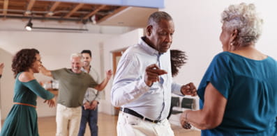 photo of a seniors dancing and making fun