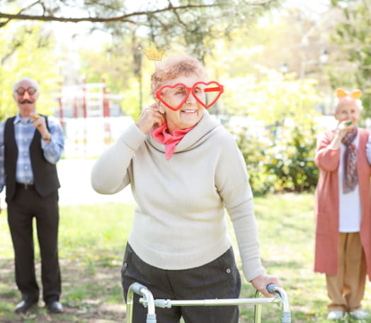 Photo of a senior wearing heart sunglasses